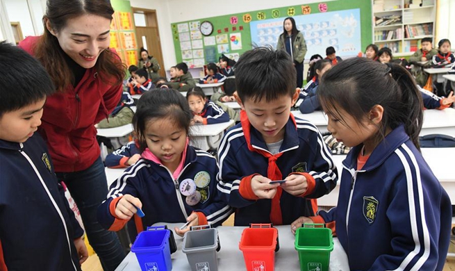 Volunteers in east China's Shandong help pupils better understand necessity of garbage classification